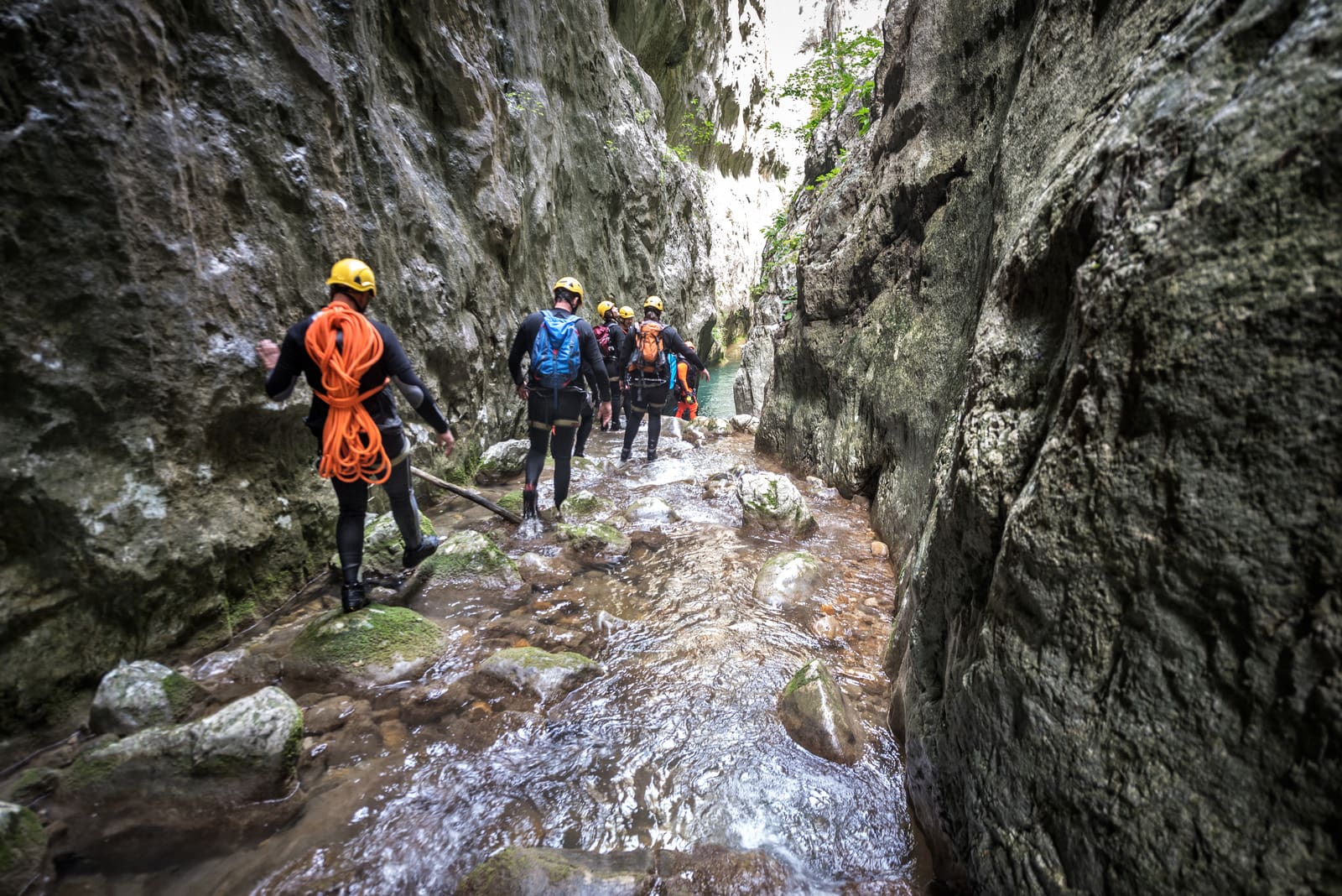Canyoning team moving through the canyon